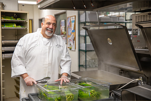 SEMO Dining Chef cleaning the asparagus for the 150 Ball