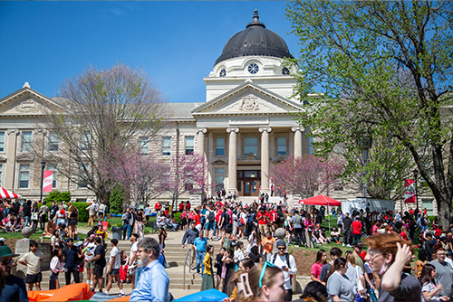 People at the block party for the Eclipse in front of Academic.