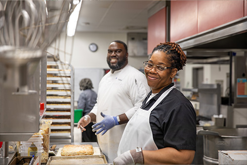 Two SEMO Dining preping food for the 150 Ball
