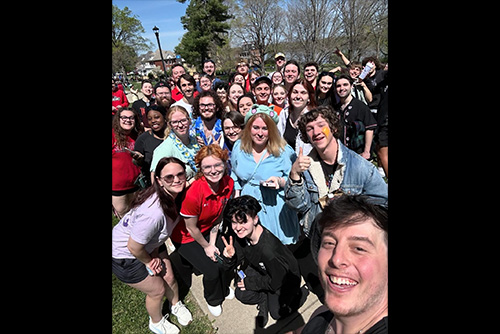 Thomas Sanders taking a picture with a group of semo students at the river campus.
