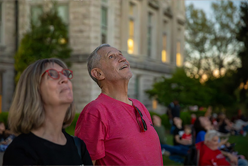 President, Dr. Vargas, and his wife looking up during total totality.