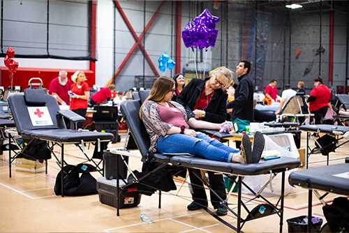 Greek student giving blood to the American Red Cross for the Greek Blood Drive. 
