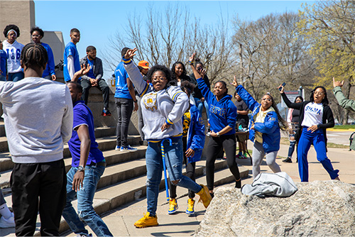 Greek Women outside steping in from of the Library steps