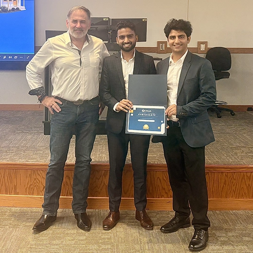 Jaimin Patel and Bhavya Narula hold their second place certificate at the Missouri Pitch Competition.
