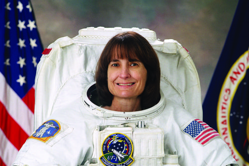 Linda Godwin poses in her space suit.
