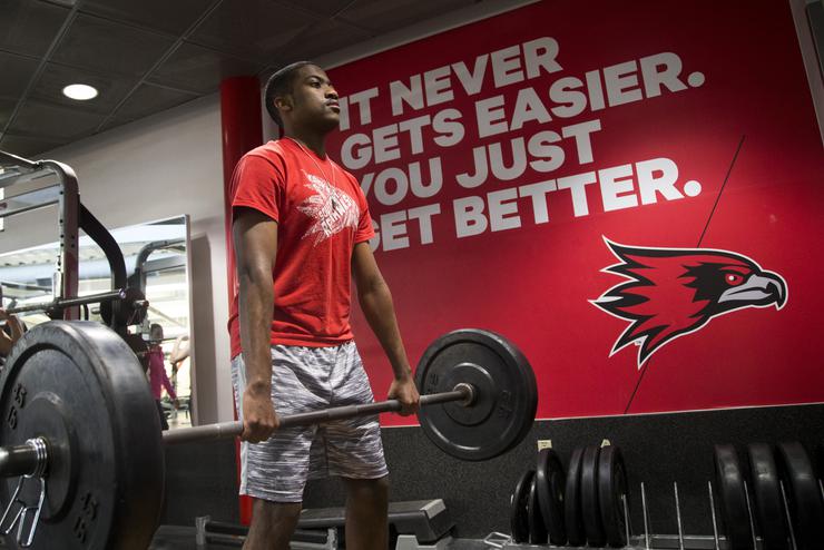 Southeast Missouri State University student performing a deadlift in the Student Recreation Center weight room where students can feel supported in their health and wellness journey.