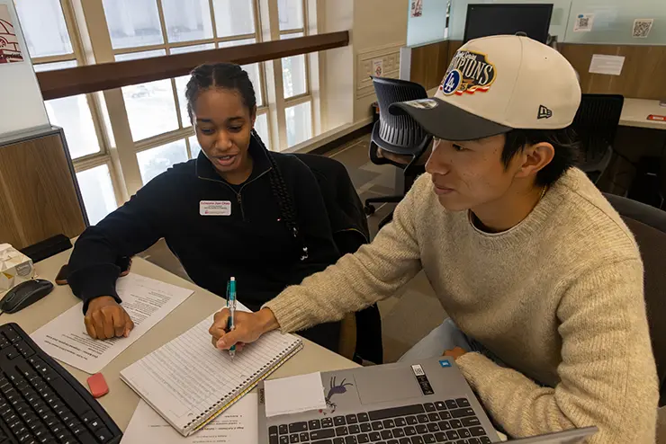 a tutor in SEMO's learning assistance office helps a student with an assignment