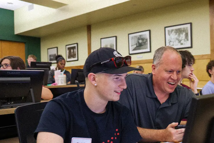 A faculty member and a student together in a lab working to improve their student experience at SEMO