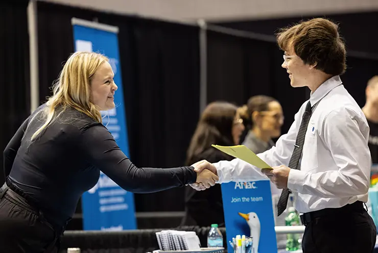 a SEMO student speaks to an employer at the career expo