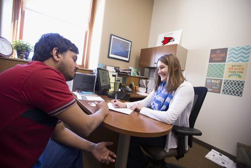 A student has their resume reviewed with a member of Career Services.