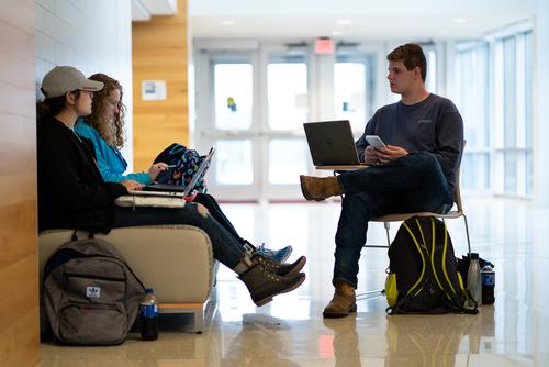 A group of Southeast students study together in the hallway of Magill Hall.