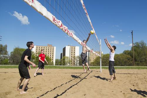 Students play sand volleyball near Towers at Southeast Missouri State University.