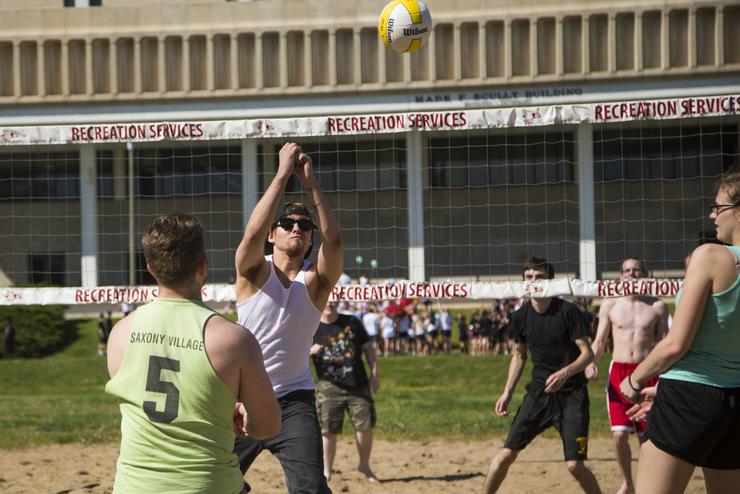 Students play sand volleyball at Recreation Service’s Parker Field.