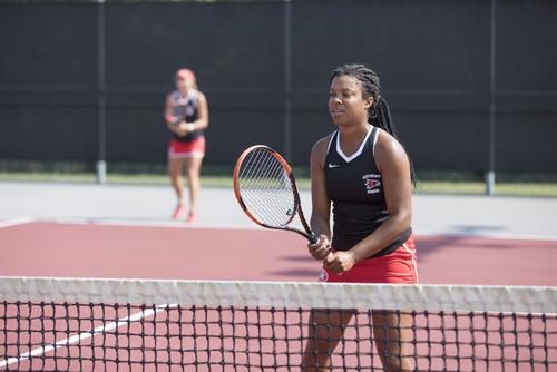 Tennis partners prepare for their opponent’s shot during a match at the SEMO tennis courts.