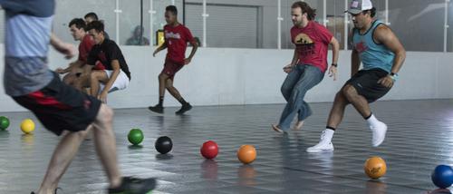 During a game of dodgeball students race to grab balls in Parker Gym’s Dashboard court.