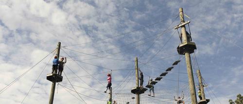 A view of the entire Challenger Ropes Course, in use during Camp Redhawk