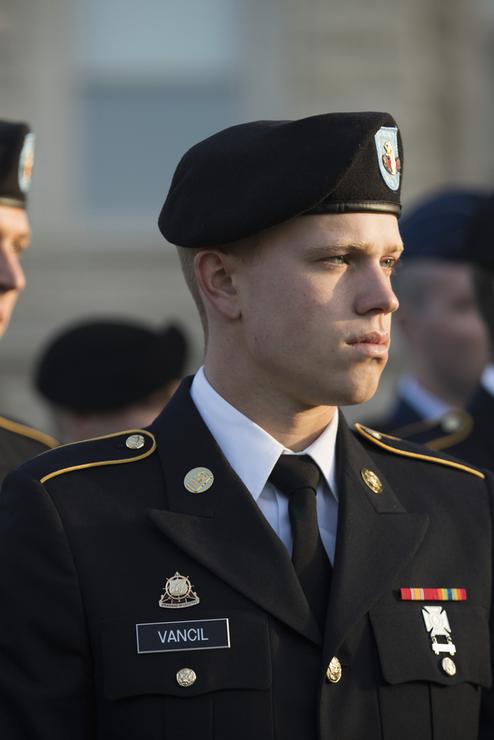 Military students attend a September 11 ceremony in dress uniforms.