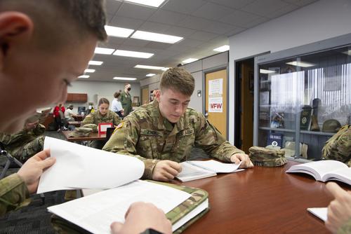 Show-Me Gold students look at notes while studying at a table.