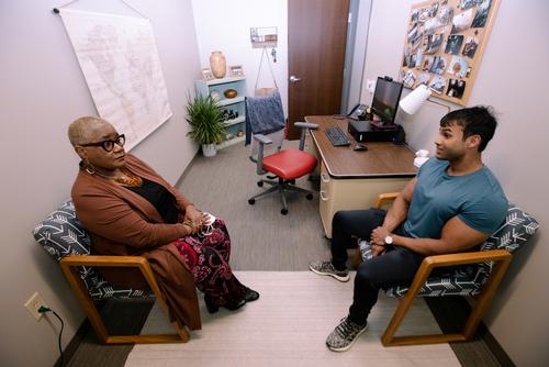 A counselor speaks with a student in the Center for Behavioral Health and Accessibility.