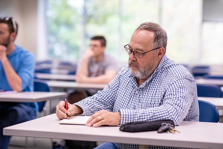 New Faculty Filling out paperwork to begin instructing