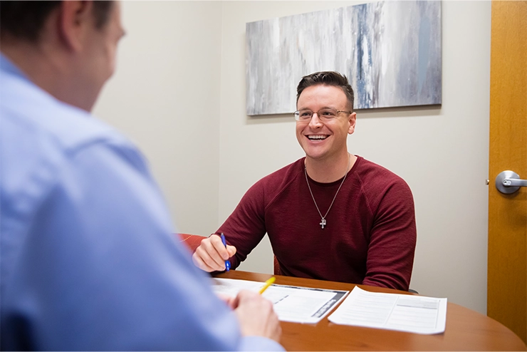 A student working with Faculty to better design their online learning page