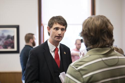 Matthew L. Kearney, director of Student Financial Services, having a conversation with another individual.